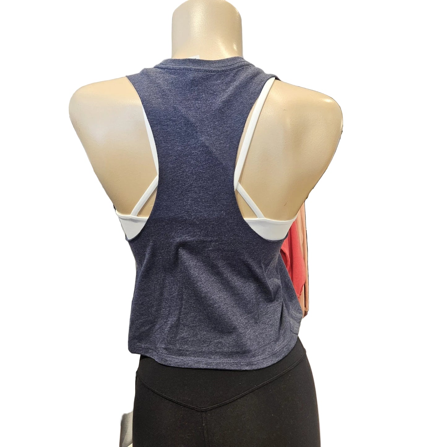 Mannequin wearing a blue tank top with white trim in a clothing store setting